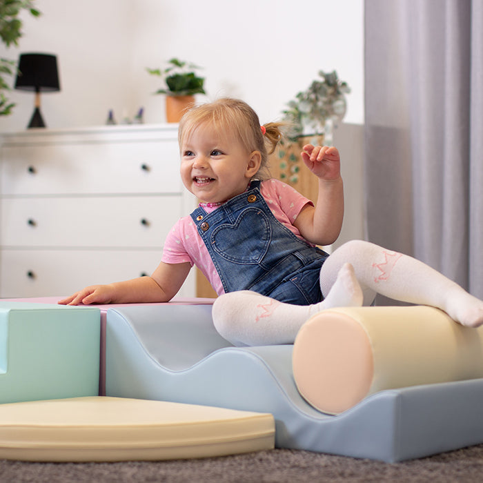 A little girl enhancing her motor skills with IGLU Soft Play - Explorer.